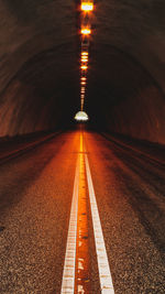 Surface level of illuminated tunnel at night