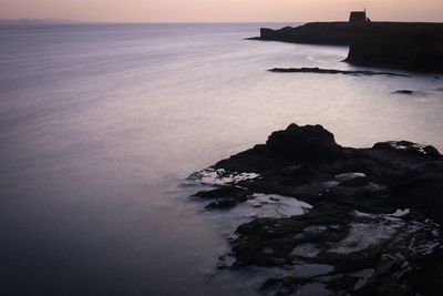 High angle view of sea against sky during sunset