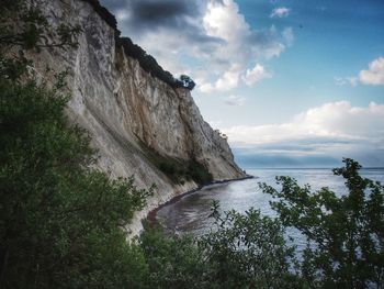 Scenic view of sea against cloudy sky