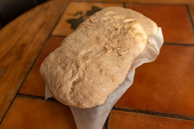 High angle view of bread on cutting board