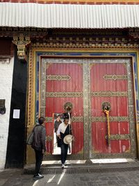 People standing at entrance of building