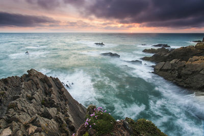 Scenic view of sea against sky during sunset
