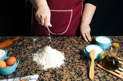 High angle view of woman preparing food on table