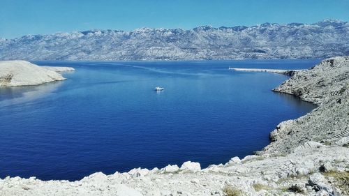 Scenic view of sea against blue sky