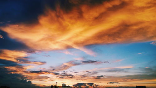 Low angle view of dramatic sky during sunset