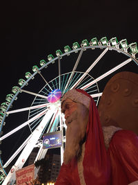 Low angle view of people at night