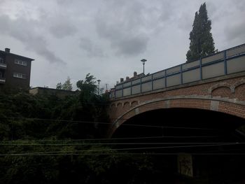 Low angle view of building against cloudy sky