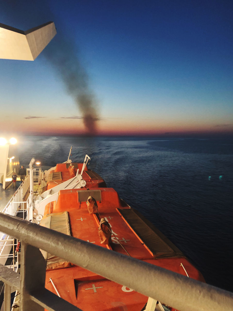 SCENIC VIEW OF SEA AGAINST ORANGE SKY