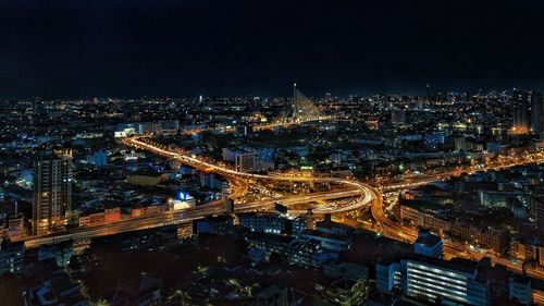 High angle view of illuminated cityscape at night