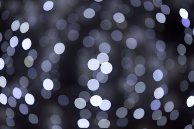 Abstract isolated blurred festive blueish lights with bokeh.