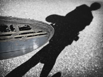 Shadow of people on road