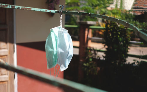 Close-up of clothes hanging on clothesline