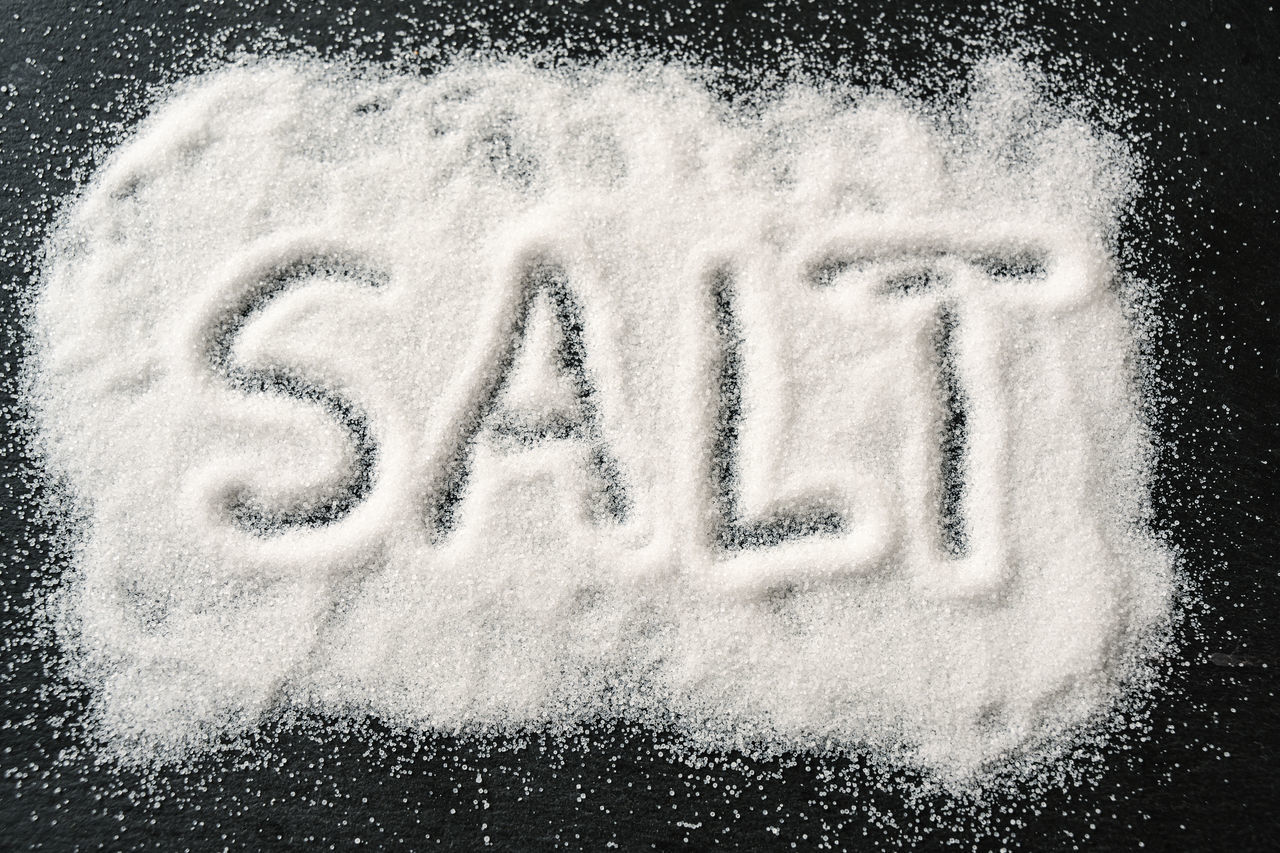 CLOSE-UP OF TEXT ON SNOW COVERED WITH BLACK BACKGROUND