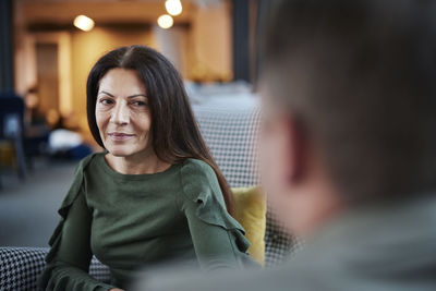 Mature woman looking at man