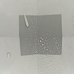 Close-up of water drops on glass