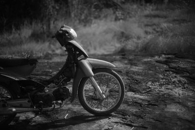 Side view of bicycle parked on field