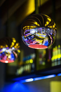 Close-up of shiny decoration hanging at bar