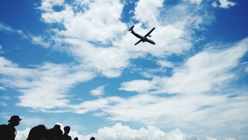Low angle view of airplane flying in sky