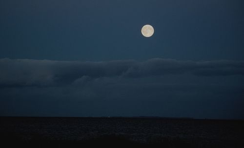 Low angle view of moon against sky at night