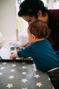 Mother and daughter preparing food in home