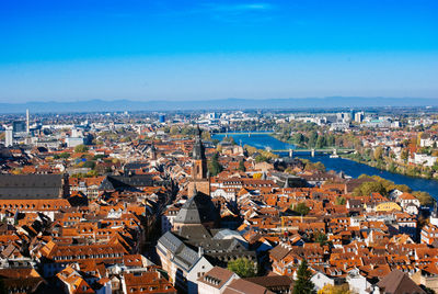 High angle shot of townscape against blue sky