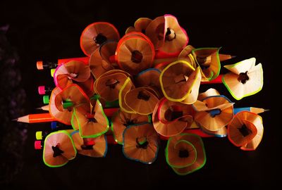 Directly above shot of colorful pencil shavings and pencils