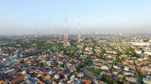 Aerial view of cityscape against clear sky