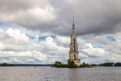 Tower amidst buildings against sky