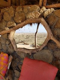 Empty chairs and rocks on beach