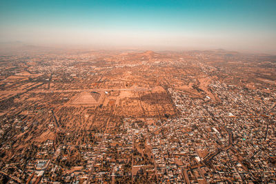 Aerial view of cityscape against clear sky