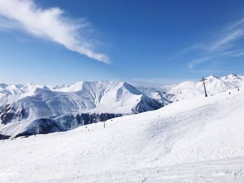 Scenic view of snowcapped mountains against sky