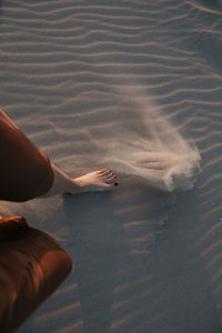 Low section of woman in water