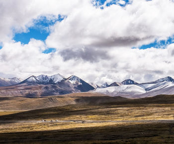 Scenic view of snowcapped mountains against sky