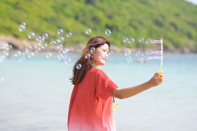 Woman standing at beach