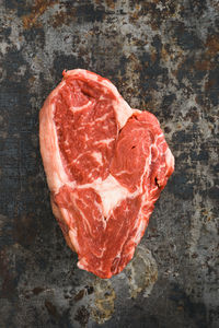 Directly above shot of red meat on cutting board