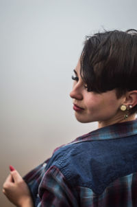 Woman with short hair against white background