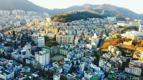 High angle view of crowd and buildings in city