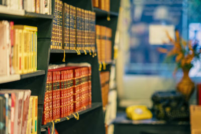 Row of books in shelf for sale