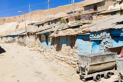 Abandoned building against blue sky