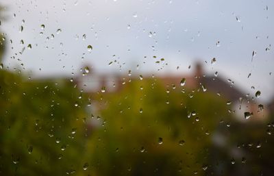 Full frame shot of wet glass window in rainy season