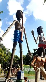 Low angle view of statue against sky