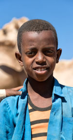 Close-up portrait of smiling boy