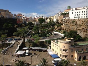 High angle view of buildings and trees against sky