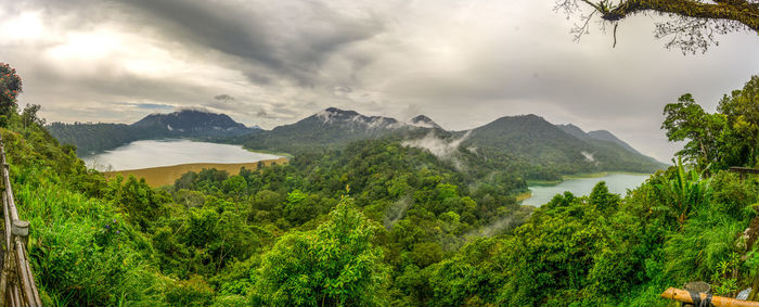 Scenic view of landscape and mountains against sky