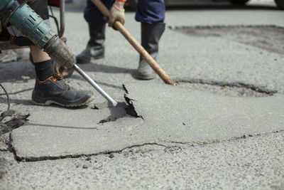 Low section of people working on street