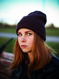 Portrait of young woman wearing knit hat