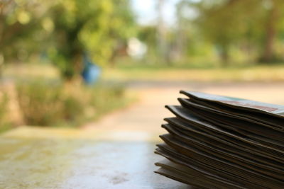 Close-up of books on table in park