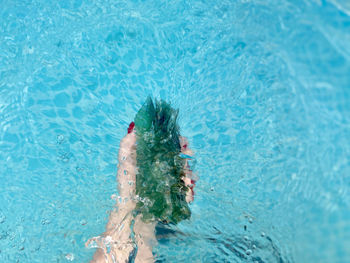 High angle view of woman swimming in pool