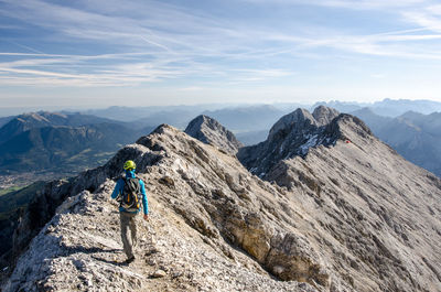 Rear view of man hiking on mountain