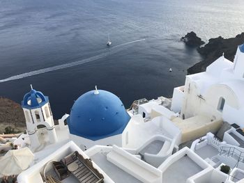 High angle view of buildings by sea